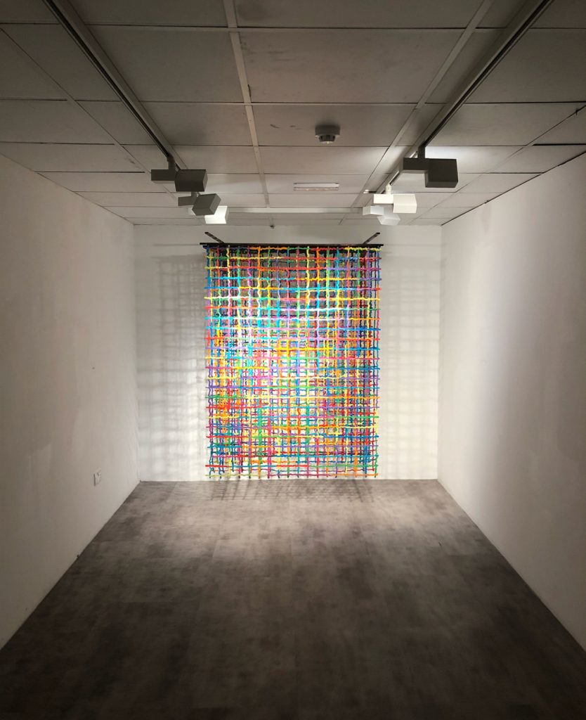 Acrylic paint on nylon, four panels on brackets and rods.