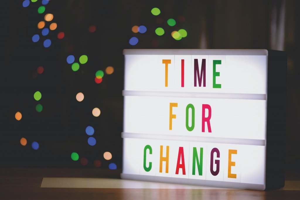 Decorative light on a table with the words ‘Time for Change’ printed on.  