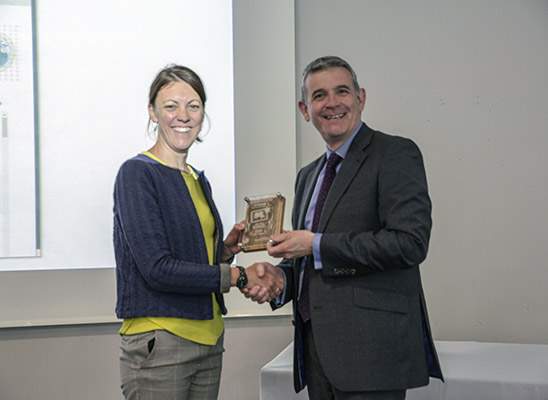 Charlotte Everitt receives her award from Prof Alex Neill