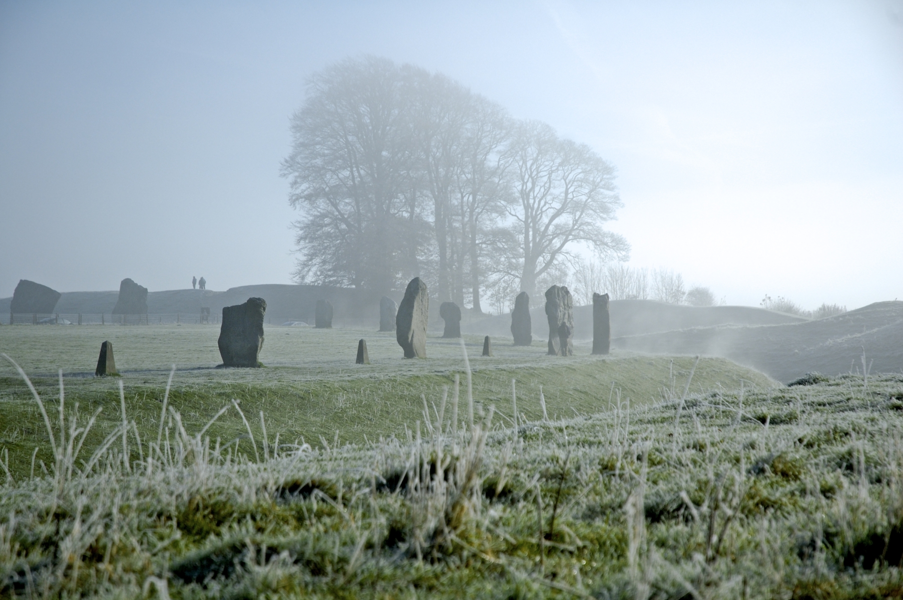 Photo of megaliths at Avebury henge in a cold, frosty morning.