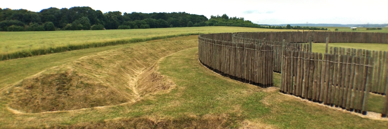 Photo of the combination of bank, ditch and palisade at the reconstructed Circular Ditched Enclosure at Goseck (Saxony-Anhalt, Germany). A great example of the possible combinations of Neolithic ditches, palisades and banks.