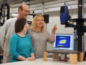 Vibrational plate experiment pictured with Janice Barton(right), Richard Fruehmann (left) and Rachael Waugh (centre) in the Testing and Structures Research Laboratory.