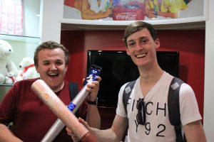 Pascal and Bradley holding the Olympic torches.