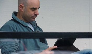 a person is pictured reading an iPad