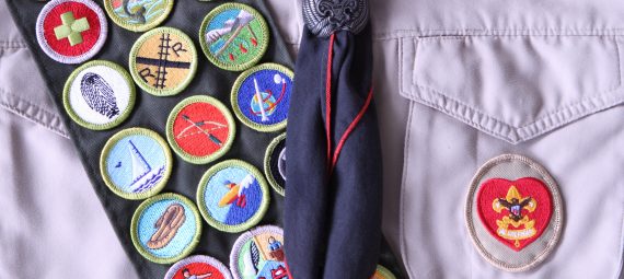 Sash with US Boy Scout badges on it.
