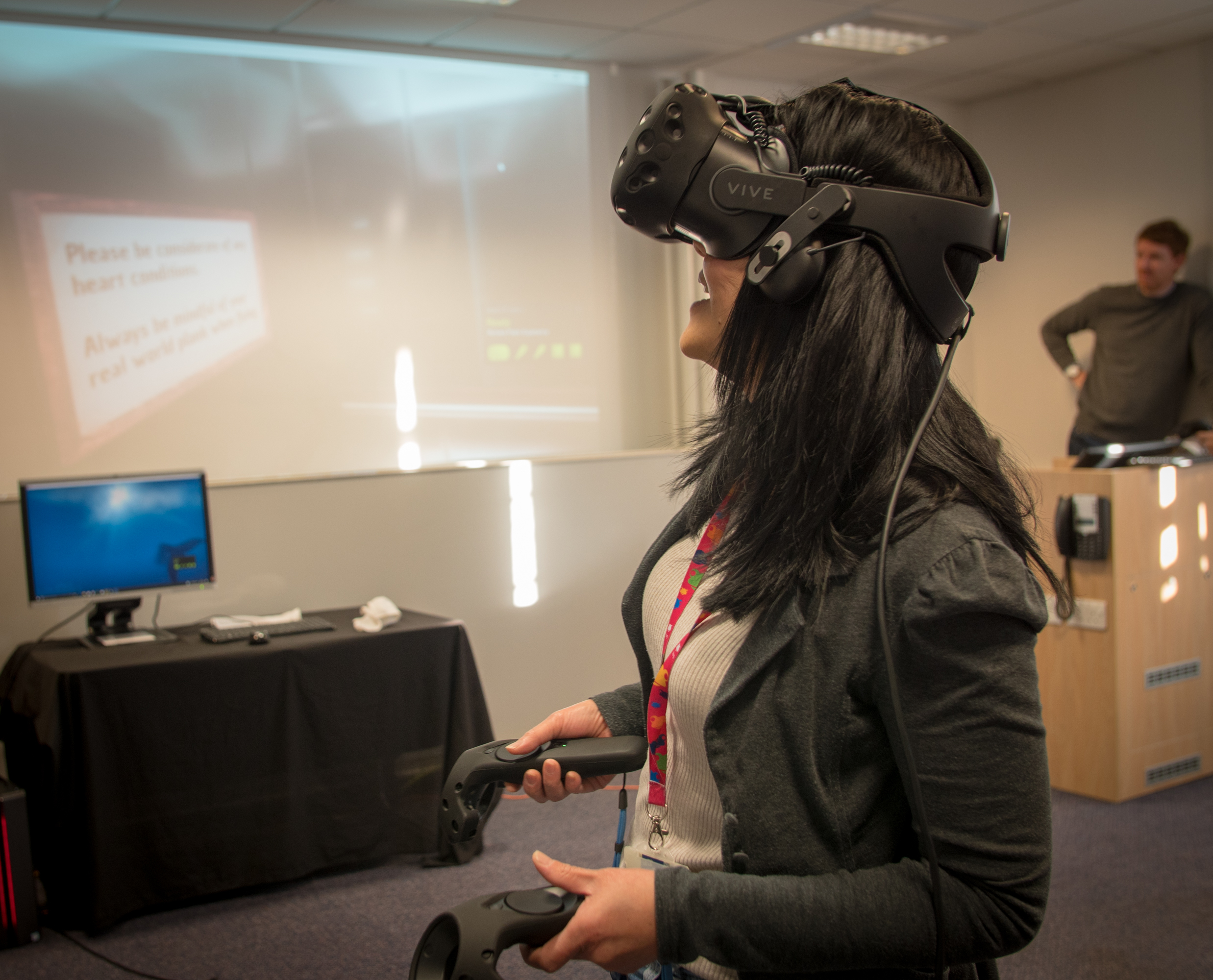 A woman wearing a VR headset.