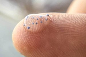 microbeads on fingertip