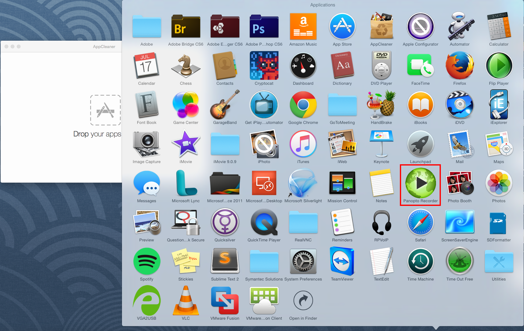 A Mac desktop displayed showing all installed applications in a folder. Next to the folder is the AppCleaner window.