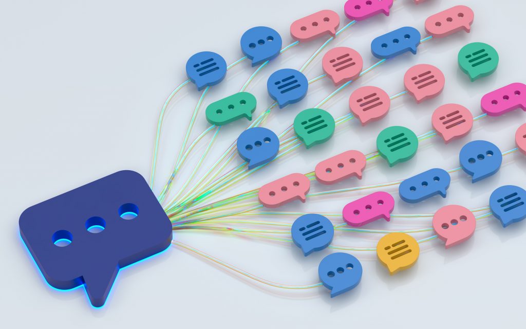 Lots of little speech bubbles connected to a larger speech bubble via digital connections.