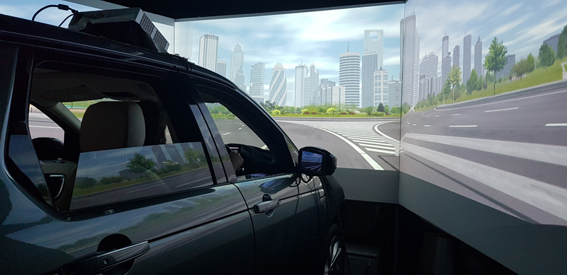 Outside the simulator vehicle showing projection screens. Photo courtesy of the Transportation Research Group.