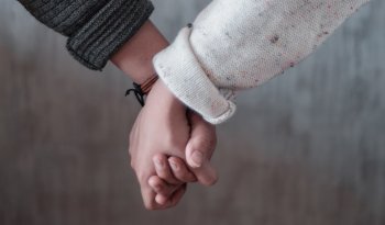 Women holding hands