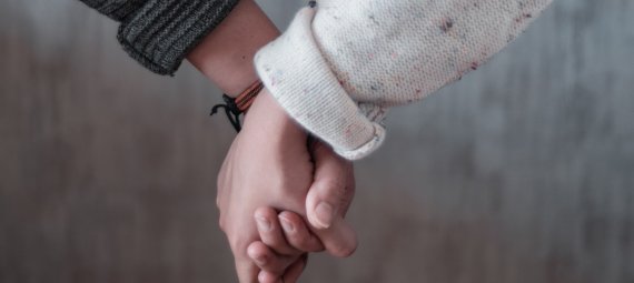 Women holding hands