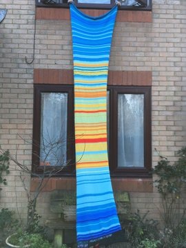The final blanket, hung from a first floor window and dangling almost to the ground